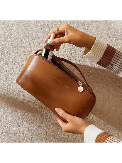 Bolsa de maquillaje de viaje portátil, impermeable, con almohada de cuero PU para mujer, bolsa de maquillaje de mano para que las mujeres la lleven.